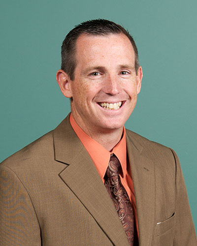 Portrait of Associate Pastor Chuck Conrad of 